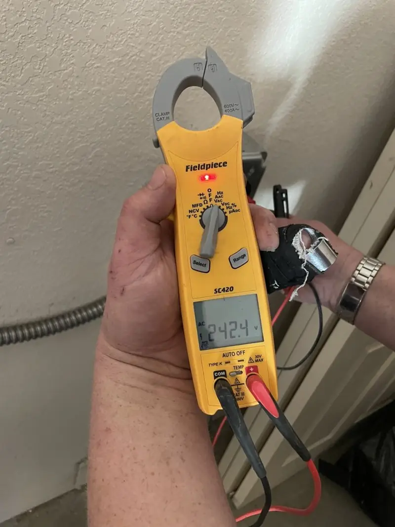 Voltage testing with clamp meter during Outlet Installation in Sayre